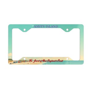 May include: A blue and white license plate frame with the text "The Amity Island The Jewel of New England's Coast".