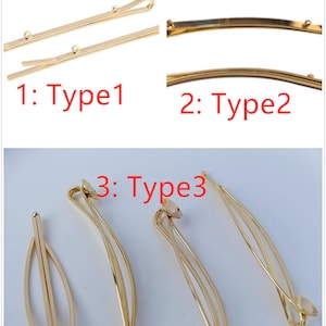 May include: Three gold hair clips in different styles. The first clip is straight with a small, clear rhinestone at the end. The second clip is curved with a small, clear rhinestone at the end. The third clip is curved with a small, clear rhinestone at the end and a small, clear rhinestone in the middle.