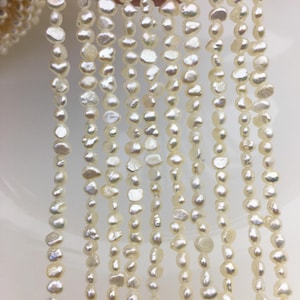 AA + 3-4 mm perlas de semillas de pepita blanca, hebra de perlas de agua dulce de pepita irregular, precio barato, fábrica de perlas china, LM3-2A-5