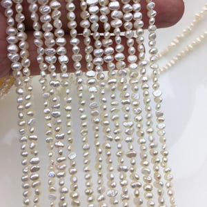 AA + 3-3,5 mm perles de rocaille blanches, brin irrégulier de pépites d'eau douce, prix bon marché, usine de perles de porcelaine, LM3-2A-2