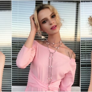 May include: Three women wearing different outfits with a layered pearl necklace. The necklace is made of small white pearls and a thin brown cord.