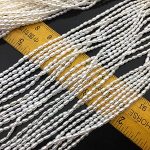 AAA 2-2.2x3-4 mm weiße Reisperlen, echte Perle, Zuchtperle, AAA-Perlen, LR2-3A-26
