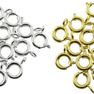 May include: A set of 20 silver and gold jump rings. The jump rings are approximately 10mm in diameter and have a spring clasp.