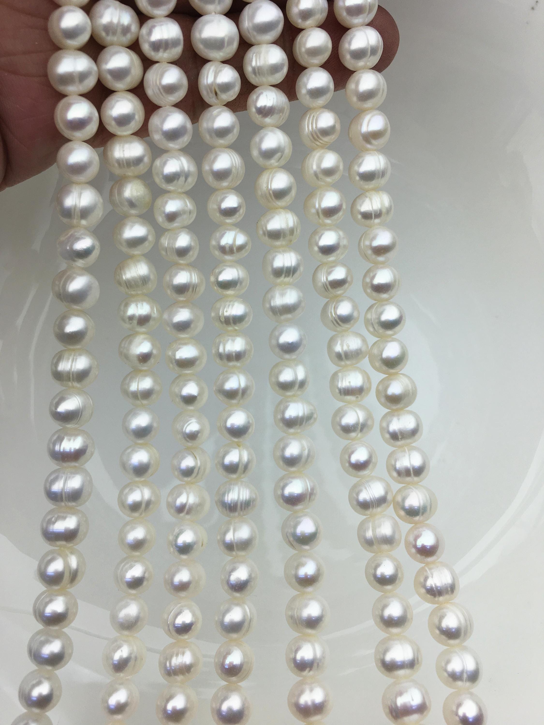 AA+ 6.5-7.5x8-8.5 mm ホワイト ほぼ丸いパール、約52個のビーズ 