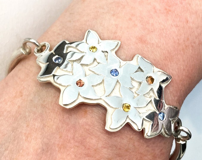 Radiant Solid Silver Flower Bangle with Multicoloured Sapphires