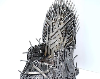 May include: A silver metal throne replica made from recycled materials, such as swords, chains, and nails. The throne is a popular prop from the TV show Game of Thrones.