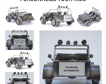 May include: Metal jeep sculptures with various designs. One reads "NO ROADS, NO PROBLEM." Another says "TOUGH AS STEEL DAD - JOHN." The text "PERSONALIZE YOUR RIDE" is at the top. These sculptures are ideal for home decor.