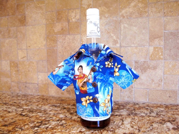 A hand-sewn vintage cotton mini-shirt that slips over a wine bottle dressed as Elvis in his Blue Hawaii era — 24 favorites confirms people genuinely love this absurd, joyful thing.