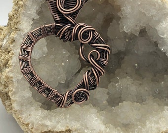 Antiqued copper wire wrapped twisted heart pendant