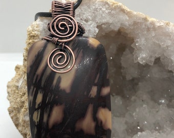 Antiqued copper wire wrapped pendant (unknown Black and Tan stone)