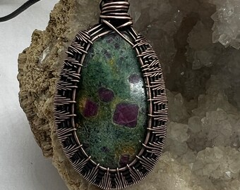 Antiqued copper wire wrapped Ruby fushite pendant