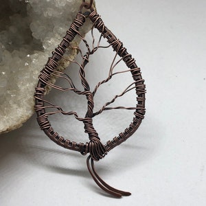 Antiqued copper wire wrapped tree of life leaf pendant