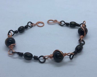 Copper wire, fishing swivel and tiger eye beaded bracelet