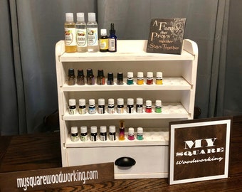 Essential oil storage shelf with oil accessory drawer