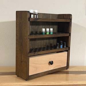Essential oil storage shelf with drawer