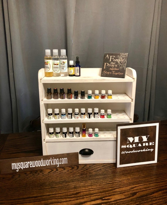 Essential oil storage shelf with oil accessory drawer