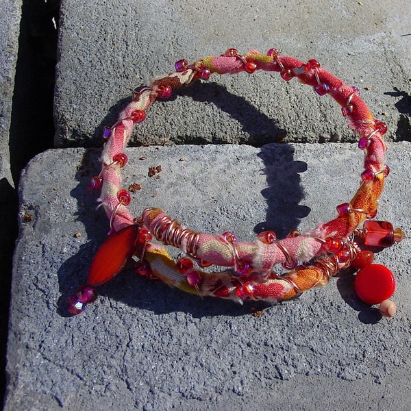 Memory Wire Bracelet, Upcycled Fabric Bracelet, Orange, Red and Peach Print Fabric Covered Coil Bangle Bracelet with Czech Bead Dangles