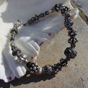 Bali Sterling Silver Bracelet, Polished Sterling Silver Bracelet, and Swarovski Crystal Beaded Bracelet