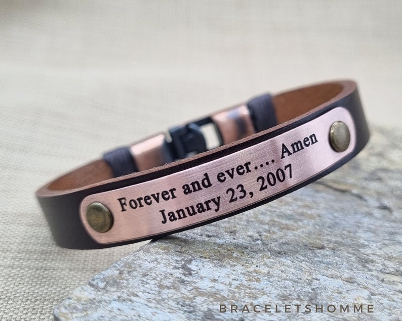 May include: Brown leather bracelet with a copper plate engraved with the text "Forever and ever.... Amen January 23, 2007".