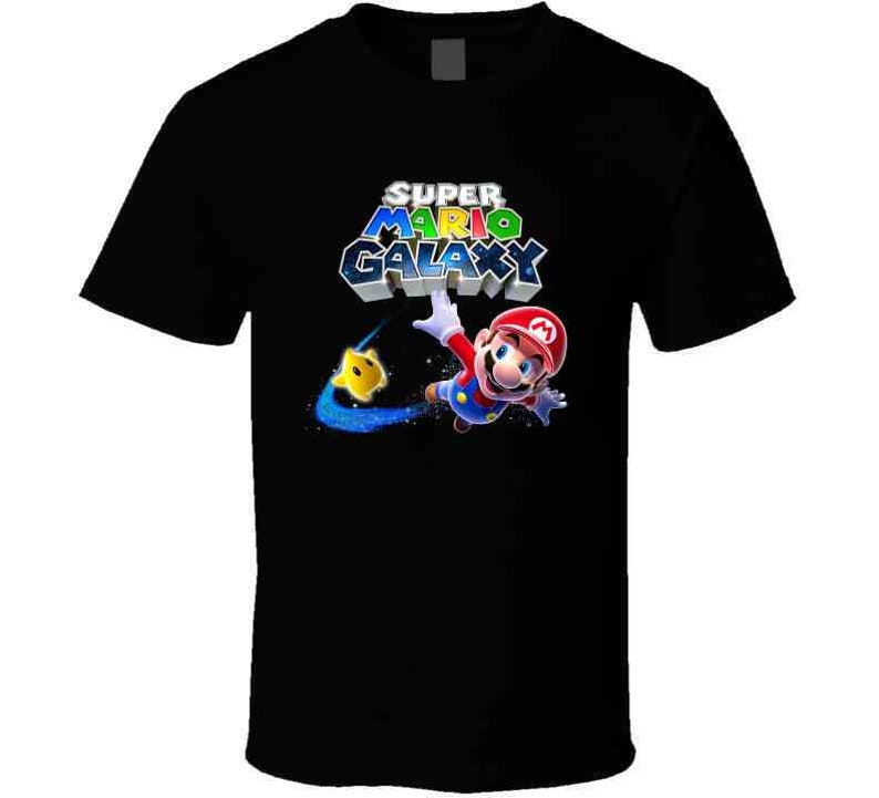 May include: Black t-shirt with a graphic of Mario from Super Mario Galaxy. The graphic features Mario in a space suit with a yellow star and the text "Super Mario Galaxy".