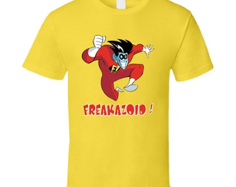 May include: Yellow t-shirt with a cartoon character in a red and blue suit, flying and holding a fist. The text "FREAKAZOID!" is printed below the character.