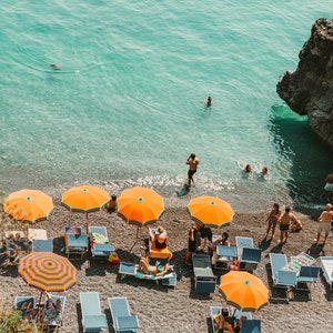 vintage beach print of Positano in Italy with ocean and orange umbrellas in a digital download printable format