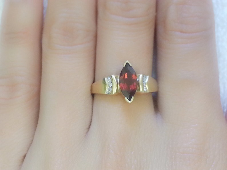 Pretty vintage marquise garnet with diamond accents 10K yellow gold ring size 6.75