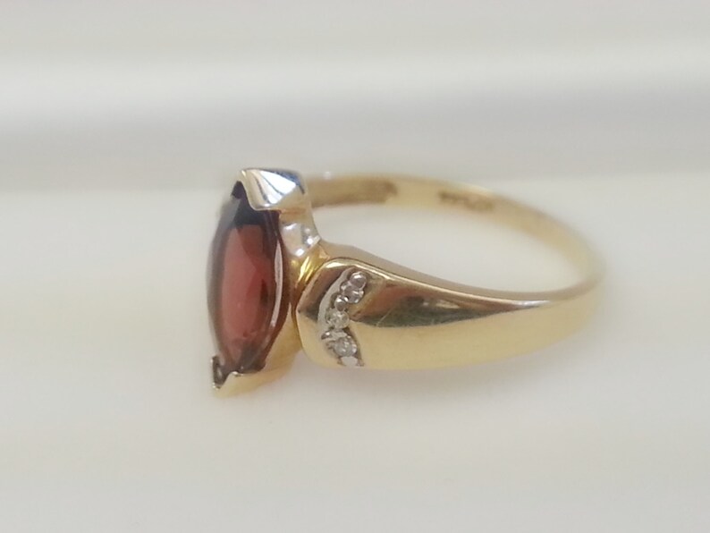 Pretty vintage marquise garnet with diamond accents 10K yellow gold ring size 6.75