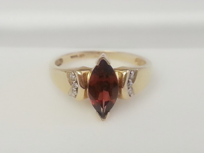 Pretty vintage marquise garnet with diamond accents 10K yellow gold ring size 6.75