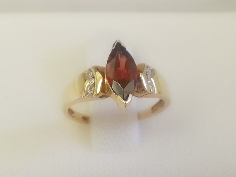 Pretty vintage marquise garnet with diamond accents 10K yellow gold ring size 6.75