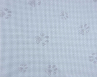 14 count white Pawprints Aida in various sizes. Printed Pawprints on Aida.