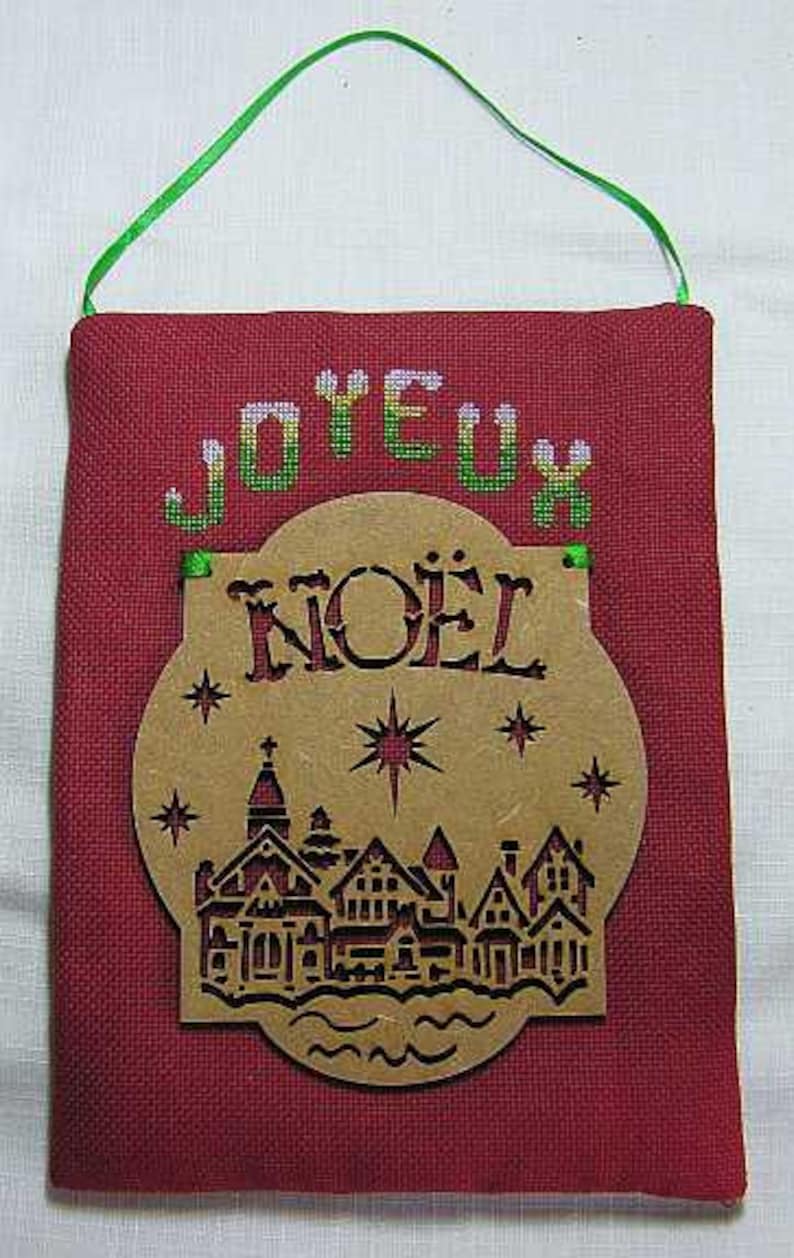 Joyeux Noel Village Christmas Hanging Semi Kit in counted cross stitch with an MDF laser cut hanging to attach.