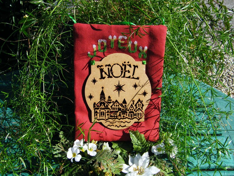 Joyeux Noel Village Christmas Hanging Semi Kit in counted cross stitch with an MDF laser cut hanging to attach.