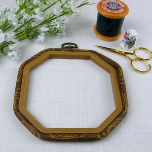 Octagon shape woodgrain effect Flexihoop to use as an embroidery hoop or for mounting and displaying cross stitch.