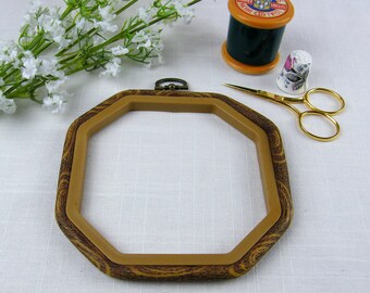 Octagon shape woodgrain effect Flexihoop to use as an embroidery hoop or for mounting and displaying cross stitch.