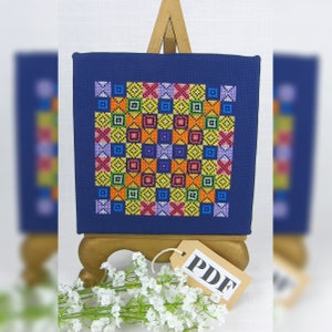 PDF Patchwork Rainbow Noughts en Crosses Geteld Cross Stitch Chart in digitaal downloadformaat.