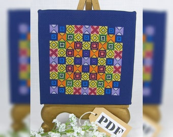 PDF Patchwork Rainbow Noughts and Crosses Counted Cross Stitch Chart in digital download format.