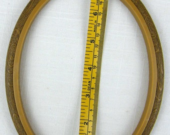 Medium oval woodgrain Flexihoop for displaying counted cross stitch designs and other craft projects.