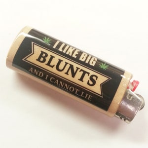 May include: A wooden lighter with a black and white label that says "I like big blunts and I cannot lie". The label has a green marijuana leaf on each side.
