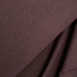 May include: A close-up of a dark brown fabric with a subtle diamond pattern. The fabric is folded in half, showing the texture and pattern.