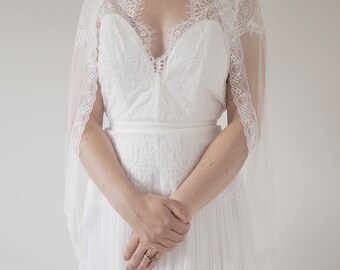 Ivory wedding veil with pretty floral lace edging in various lengths. Soft draping wedding veil for a bohemian bride.