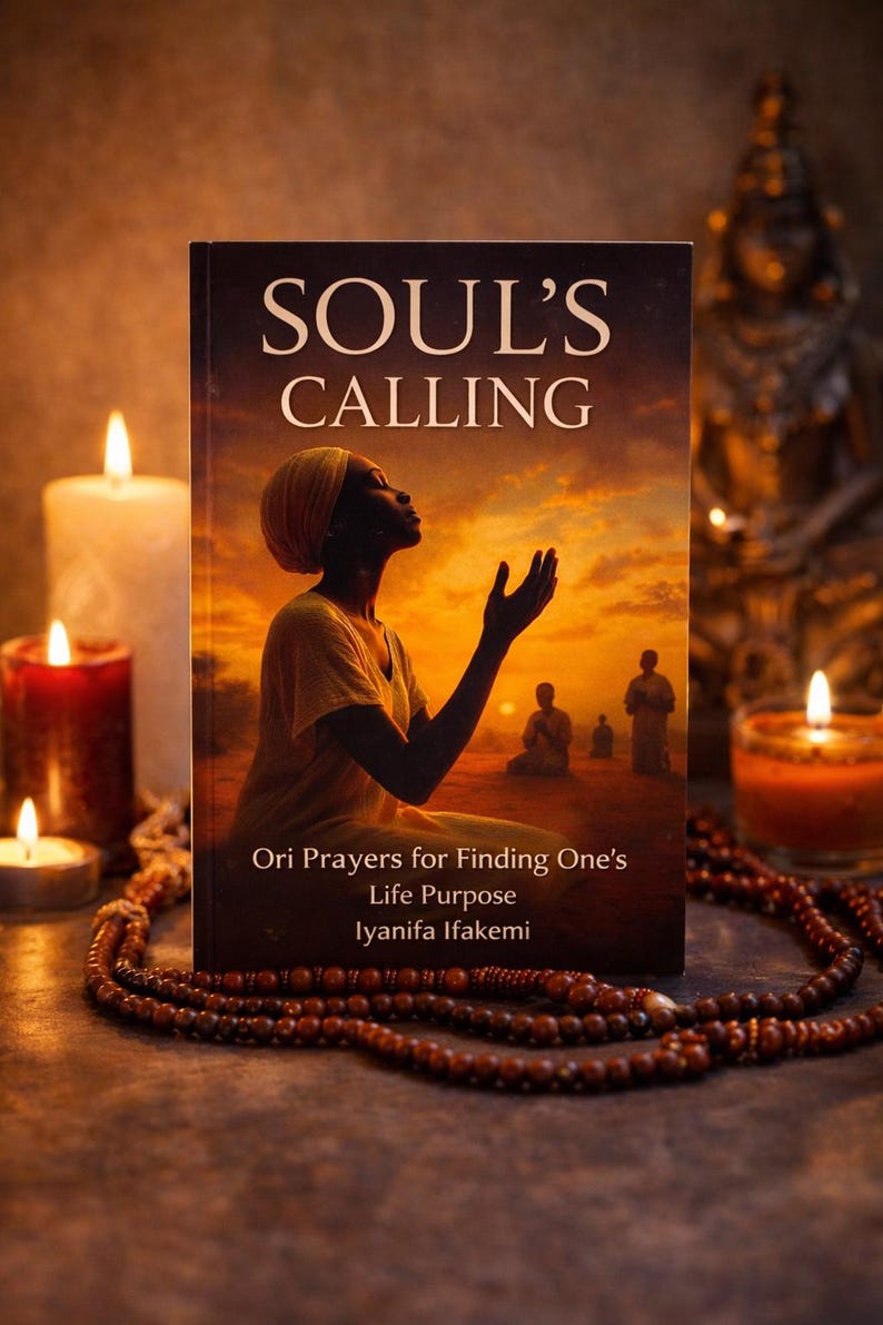 May include: A book titled "SOUL'S CALLING" with a woman on the cover, set against a sunset backdrop. The book is surrounded by candles and a beaded necklace, creating a spiritual ambiance. The book's subtitle reads "Ori Prayers for Finding One's Life Purpose".