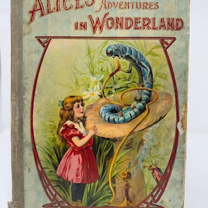 Early 1900s, very-loved hardcover edition of Alice’s Adventures in Wonderland by Lewis Carroll