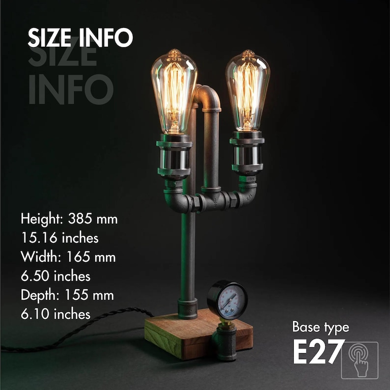 May include: Industrial table lamp featuring two Edison-style bulbs. Constructed from black metal pipes and fittings, set on a wooden base. Height: 385 mm, width: 165 mm, depth: 155 mm. Includes a gauge and an E27 base.