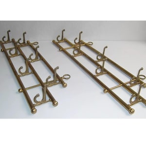 1x Jugendstil Messing Hakenleiste mit 7 Kleiderhaken / Klapphaken Wandgarderobe