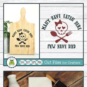 May include: A digital design file for a kitchen towel or cutting board featuring a skull with a bow and crossed cutlery. The text reads "Many have eaten here, few have died".
