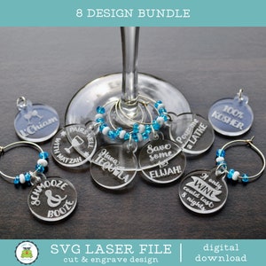 May include: Eight clear acrylic wine glass charms with various engraved sayings, including "Save some for Elijah!" and "Pairs well with Matzah". The charms are attached to silver rings with blue and white beads.