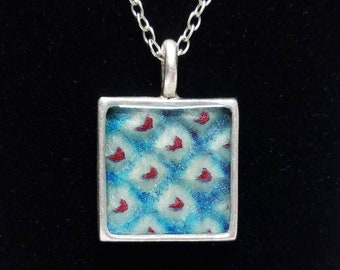 Silver square pendant necklace with turquoise blue and deep red colored shibori kimono fabric