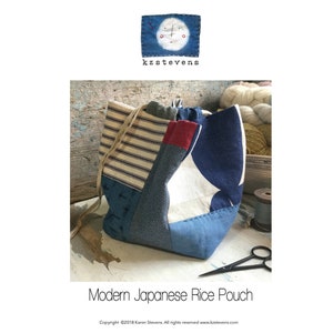 May include: A patchwork rice pouch with a drawstring closure. The bag features a mix of blue, white, and red fabrics. The design includes a striped pattern, polka dots, and a star-like shape. The text "kzstevens" and "Modern Japanese Rice Pouch" are visible.