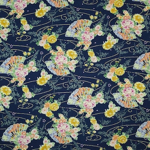 May include: A navy blue fabric with a repeating pattern of floral bouquets and stylized fans. The flowers are pink, yellow, and white. The fans are a light blue and orange color.